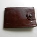 Vintage 1950 ID wallet with receipts, news paper cuttings, football cards and photos