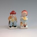 Two Vintage Bisque doll figurines girl and boy marked japan