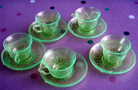 plastic tea cups with saucers