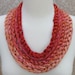 Five Shades of Orange and Pink Crocheted Yarn Necklace