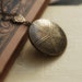 Embossed Victorian feathers brass locket necklace. Vintage look.