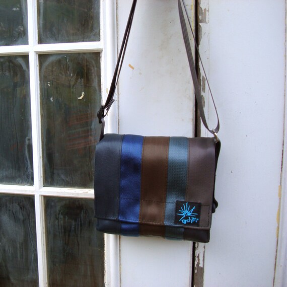 Seat belt bag made from reclaimed seatbelts.