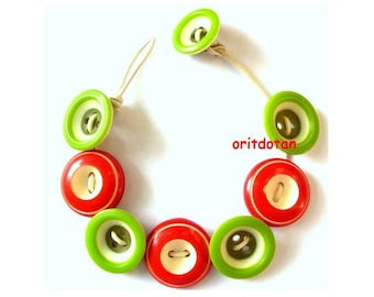 Jewelry made of vintage buttons, red green white colors on leather cord