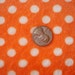 Minkee White Polka Dots on Orange Fabric 1 YD