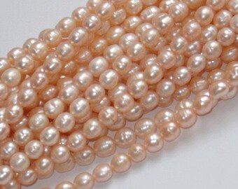 16 in strand of cultured freshwater rice pearls peach 7-8mm