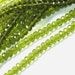 8 in strand of Peridot quartz glass faceted rondelle beads 5X8mm