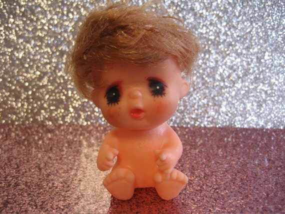 Vintage baby with freckles and light brown hair plastic doll