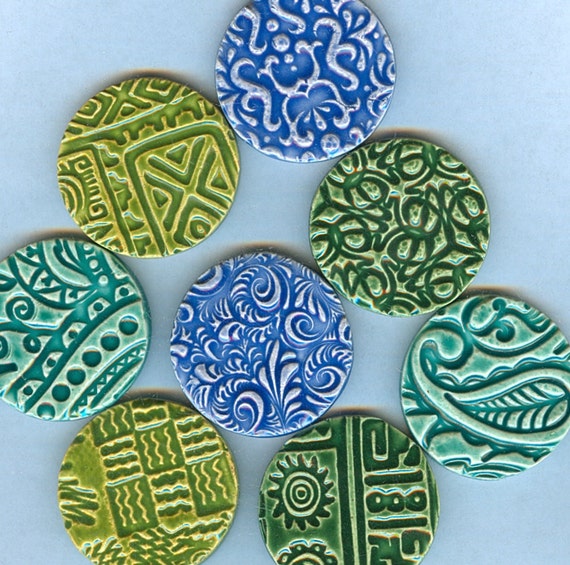 8 handmade round embossed ceramic tiles with intricate designs