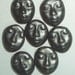 black ceramic faces...burnished steel matte glaze