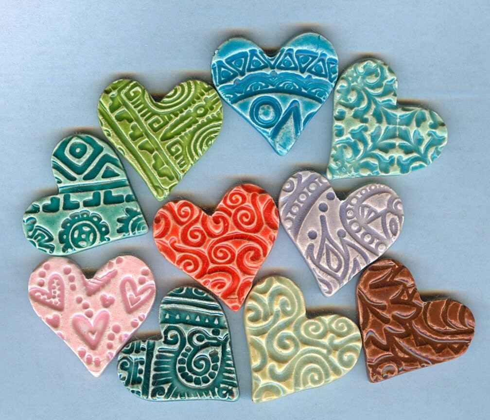 10 colorful clay hearts with embossed designs by firedandfused