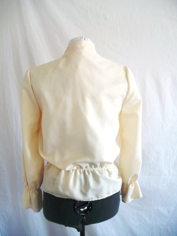 high neck cream blouse