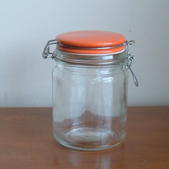 glass jar with orange ceramic lid
