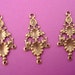 4 brass ox pod floral charms open cut triple loop chandelier