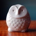 white ceramic owl figurine