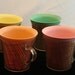 Four 1960s Raffiaware Type Plastic Mugs - Orange, Pink, Yellow, Turquoise