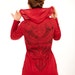 red hoodie, light cotton, aztec tribal design stenciled on the back