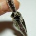 Obsidian arrowhead with garnets, pendant