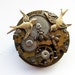Steampunk clockwork birds and bees brooch