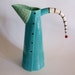 funky turquoise pitcher all buttoned up