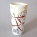 Tall porcelain beverage cup with translucent bottom