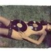 8x10 polaroid transfer of girl with records-signed by artist
