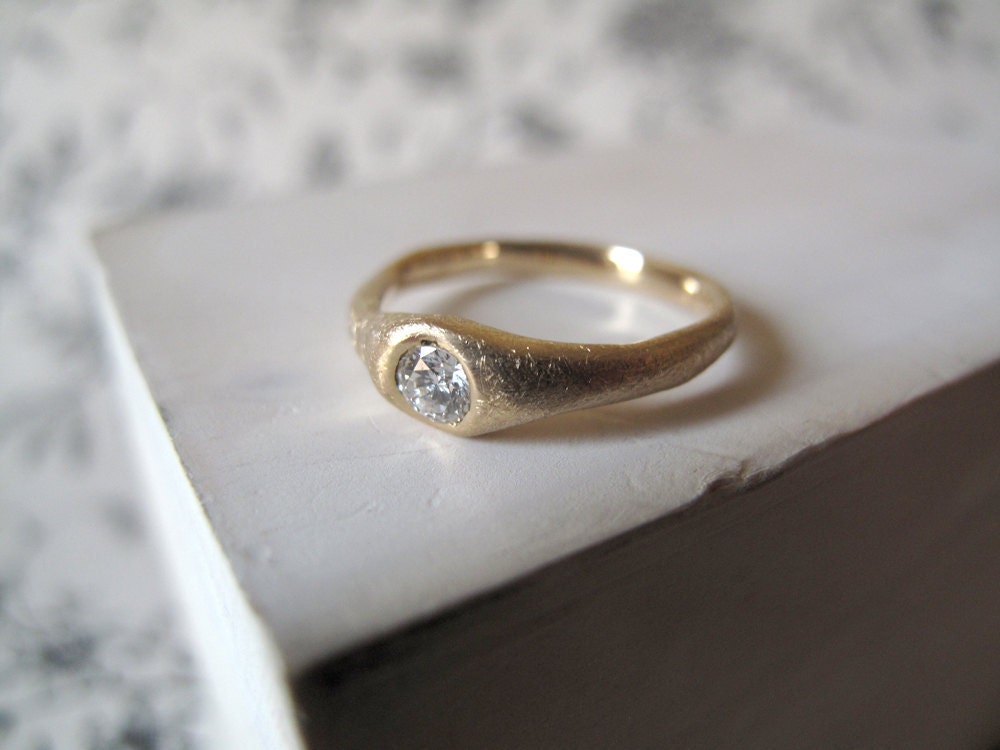 yellow gold solitaire ring with simple platium wedding band