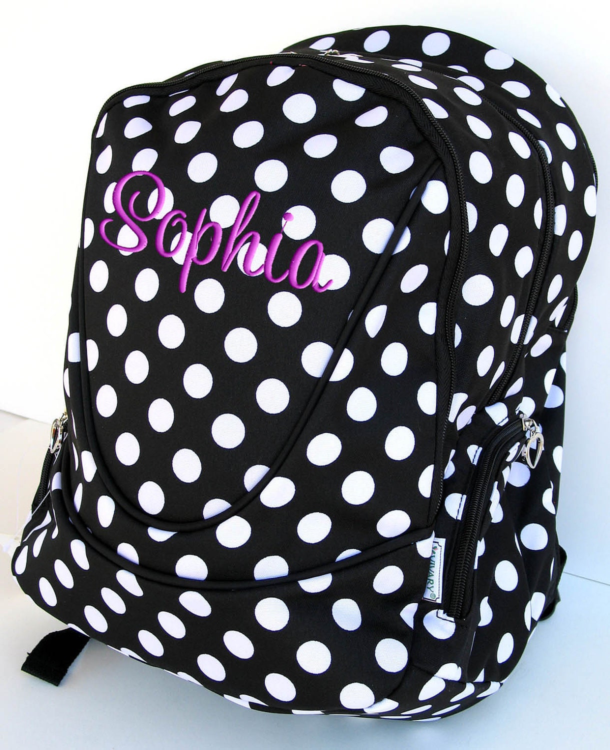 black polka dot backpack
