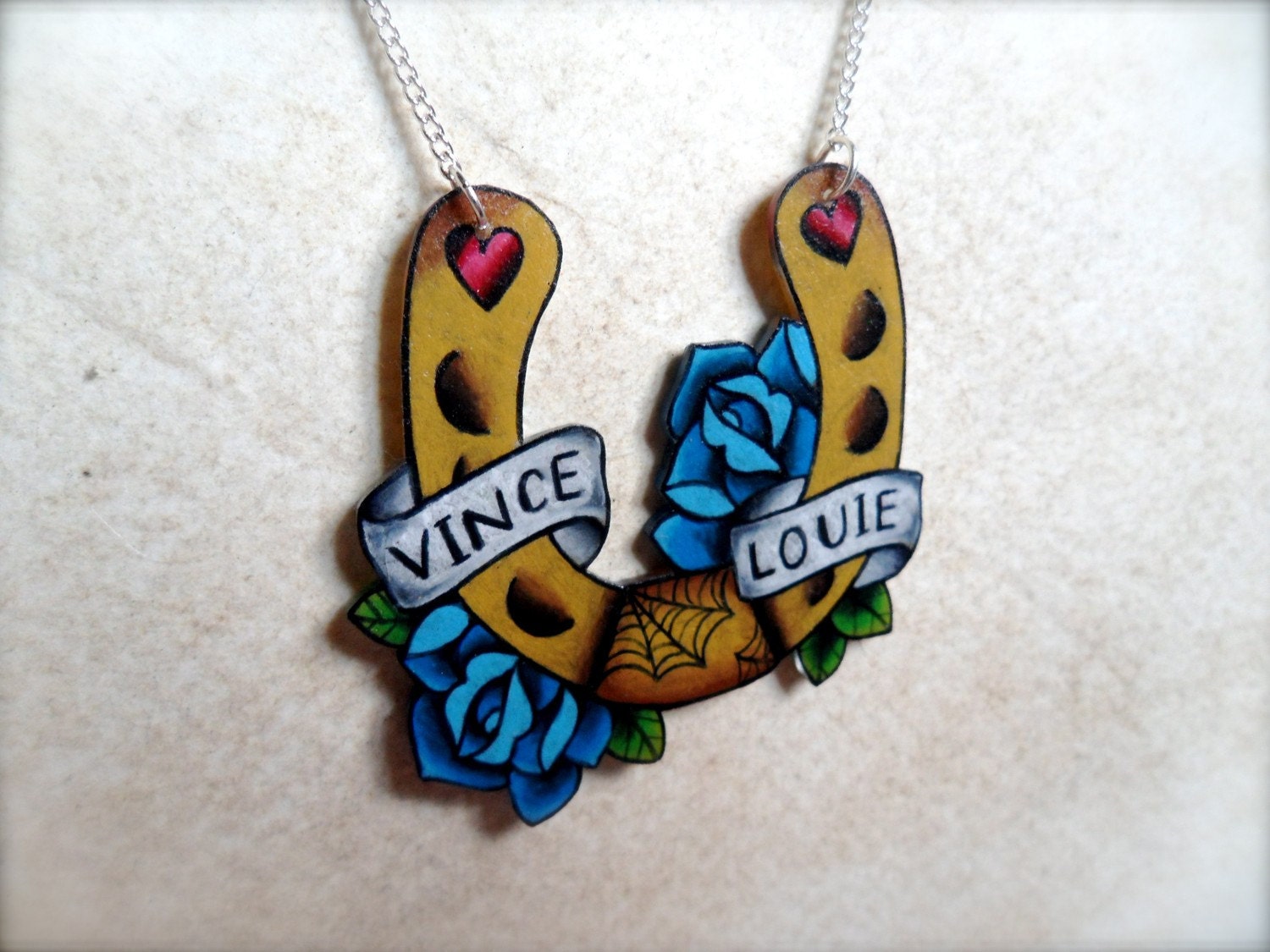 tattoo horseshoe and blue roses necklace