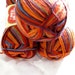 Superwash wool self striping Sock yarn, Tequila Sunrise, orange, brown, blues, Heart & Sole