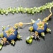 Peridot and Iolite earrings with Clay floral details in 24K bali vermeil - Serenading the Stars
