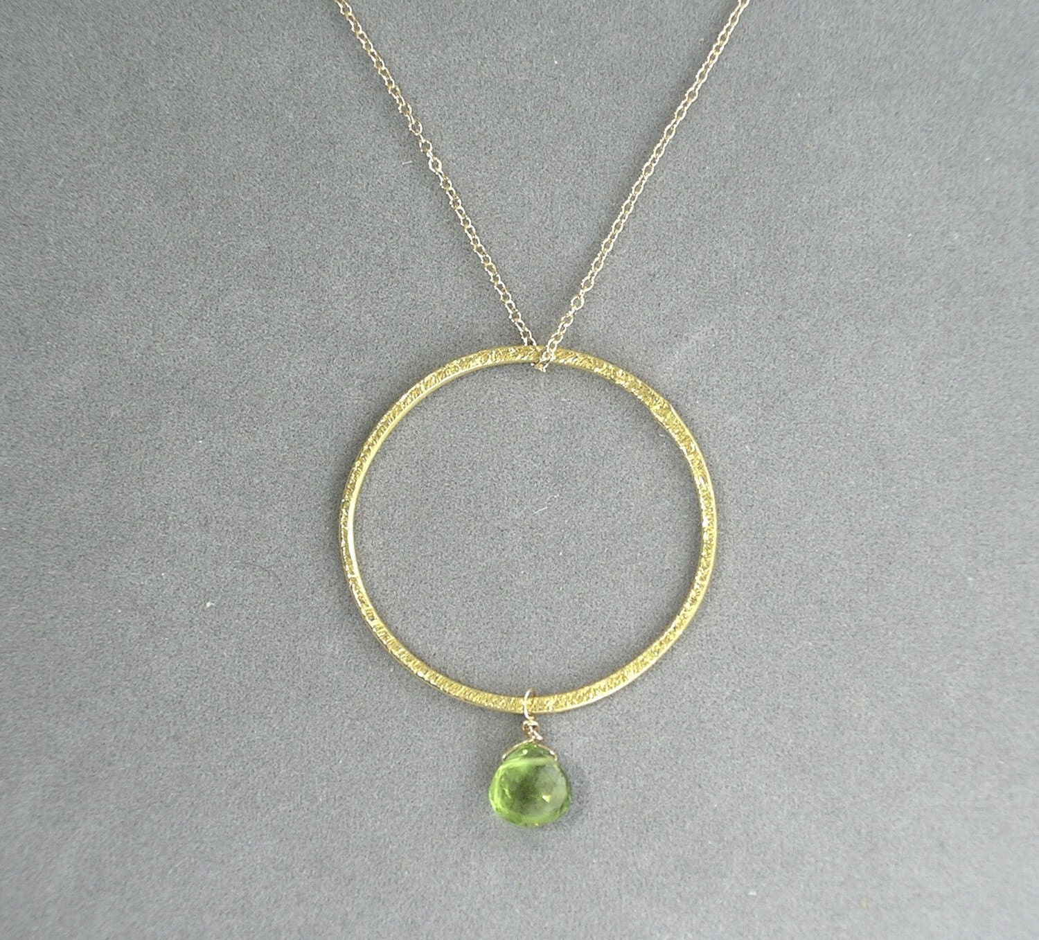necklace with brushed gold hoop and peridot by rockedjewelry