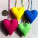 Bright yellow, blue, green, and pink felt heart ornaments ready to ship