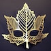 Maple leaf cut out leather mask in gold