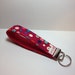 Keychain, key fob, key wristlet, key holder. Pink with circles.