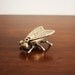 Vintage brass fly with flip up wings