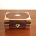Vintage wooden box with brass inlay