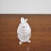 Vintage crystal oval box with perched bird on lid