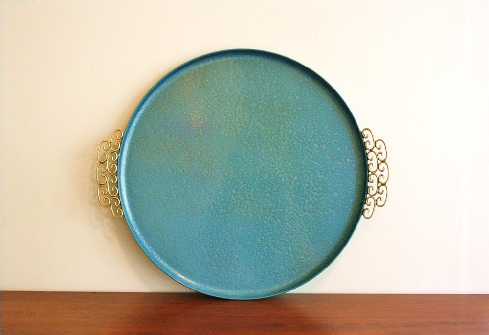Round blue serving tray with Asian handles and brass accents