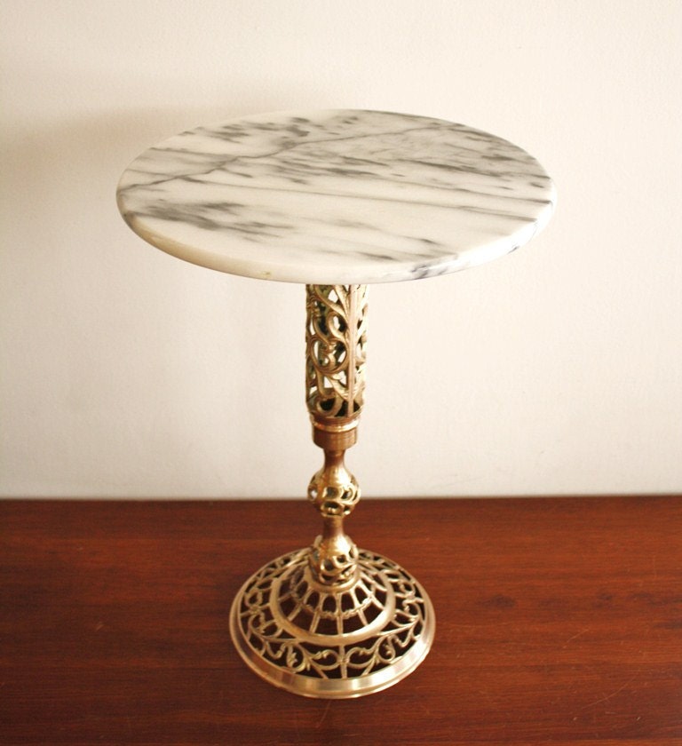 Vintage marble top side table with a brass base