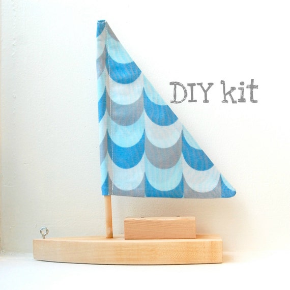 DIY toy sailboat with blue waves sail
