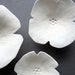 Wall art sculpture Three Little Graces Set of handmade porcelain flowers in pure white Minimalist installation, pretty, elegant home decor