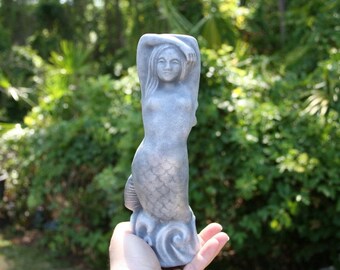 large concrete mermaid statue