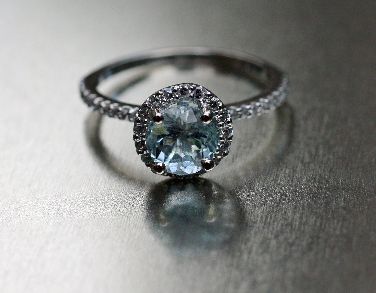 Aquamarine halo diamond ring