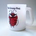 Grump bug. Vintage 1960s milk glass mug, Avis advertisement.