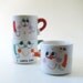 Papel Mug People, three small 1970s mugs.