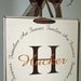 Families are Forever vinyl lettering circle, with your personalized monogram initial and family name on a board w/ribbon