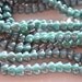 Luster Turquoise 6x4mm Baby Bell FLowers 50