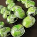 3 pcs --- Lampwork Bead with Green/White Swirls and Silver Foil