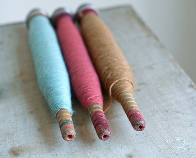 three vintage textile bobbins