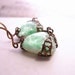 MINT earrings with vintage green art glass and filigree